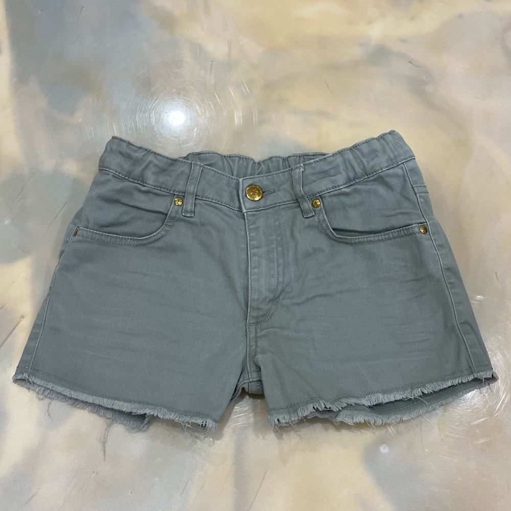 Camouflage green raw egged shorts.